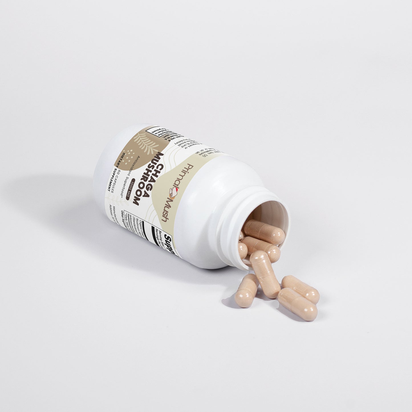Supplement bottle with pills spilling out on a light gray background